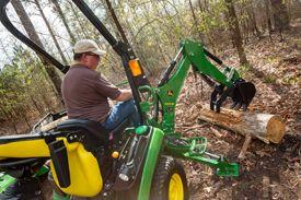Lift heavy logs with BH160 Backhoe