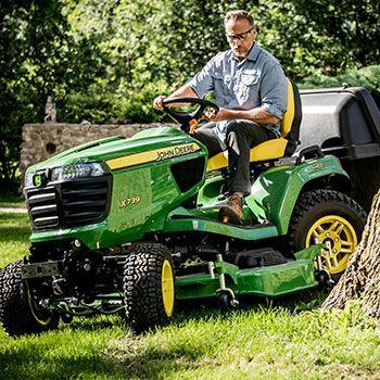 X739 Tractor trimming around a tree