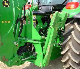 595 Backhoe on a 5M Tractor