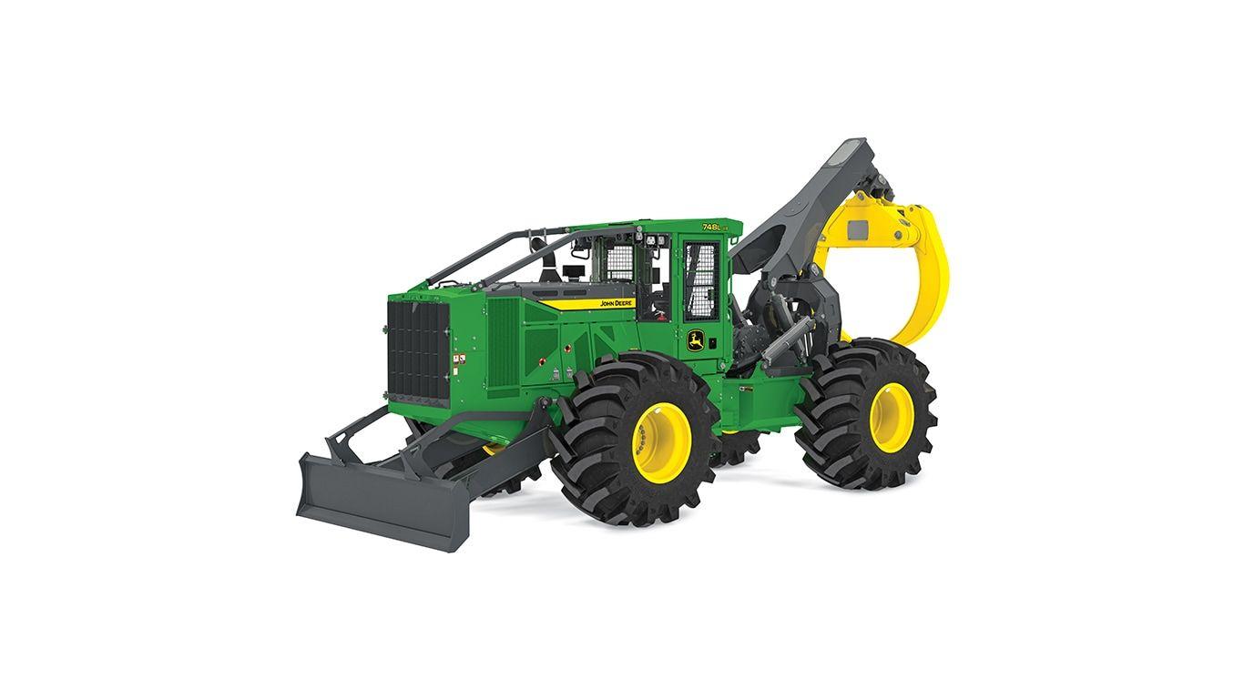 Green and yellow forestry machine with large tires and rear claw attachment.