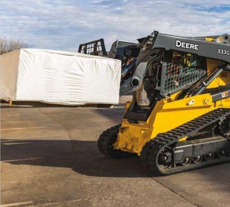 333G Skid Steer with PF-Series pallet forks attachment, hauling a pallet.