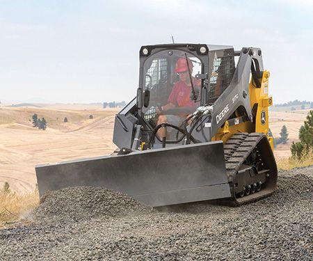 317G Compact Track Loader equipped with Dozer Blade
