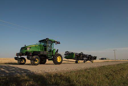 D1500 integrated slow-speed transport system behind W170 Windrower