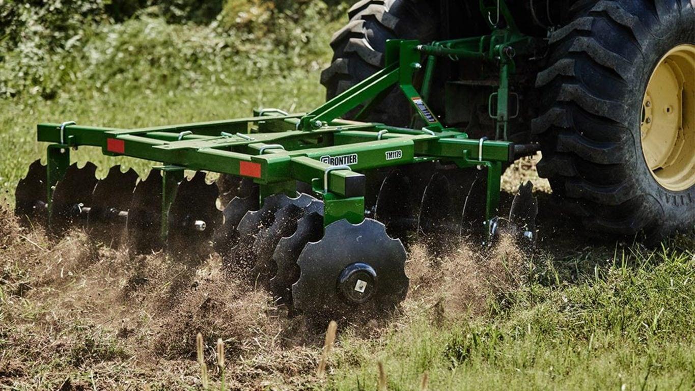 The Frontier TM1179 Series Tandem Disk Harrow in action.