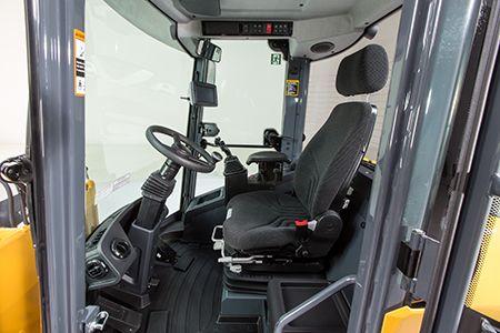 Hi-Back seat and adjustable steering column within cab