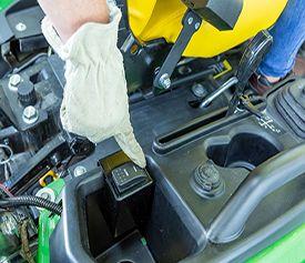 Dump-from-seat rocker switch to open and close the gate from the seat