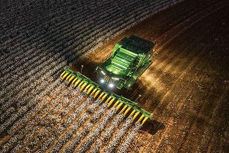 CS770 harvesting cotton at night