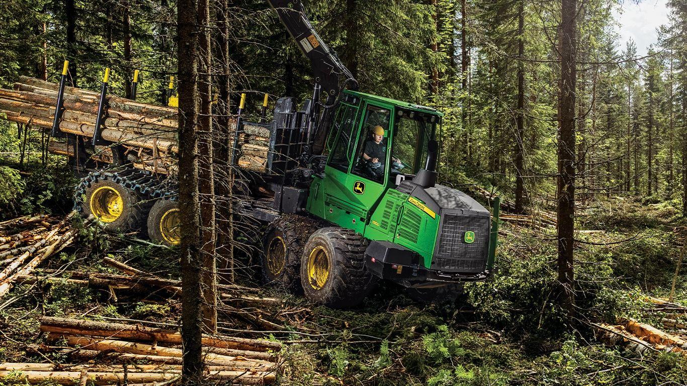 1110G forwarder hauling timber through a forest