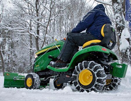 44-in. (112-cm) Front Blade used for snow removal (shown with optional angling and electric lift)