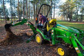 Move piles of brush with BH160 Backhoe
