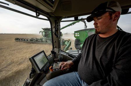 Machine Sync takes away the stress of unloading crop into a cart or wagon on-the-go