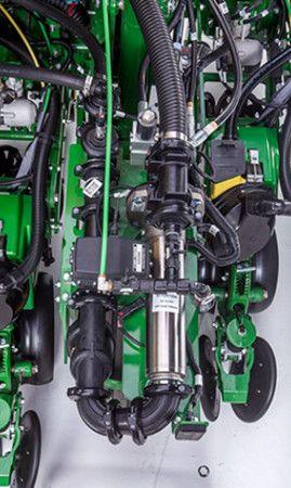 Pump assembly at rear of planter