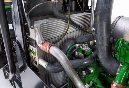 Stacked cooling system on a wheeled harvester