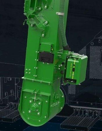 Fully integrated on the clean grain elevator and plugged in the combine harness
