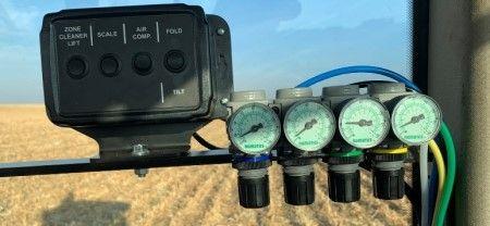 Air regulators for row unit downforce