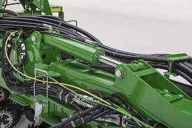Hydraulic cylinder mounted on planter wings for frame weight distribution