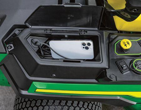 Covered storage compartment charging a cell phone