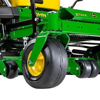Right mower anti-scalp wheel and center rollers