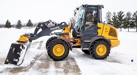 SP10C featured on 244L removing snow from parking spot