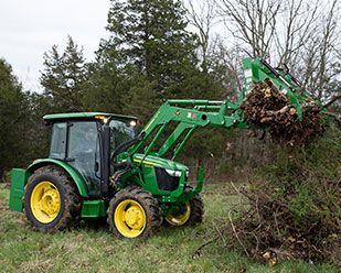 Premium cab with triple mid SCV operating grapple