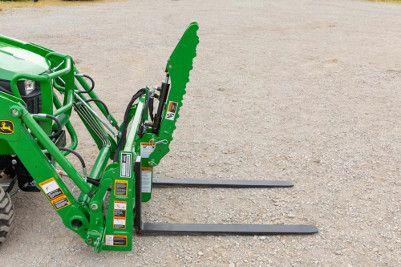 Serrated grapple tine